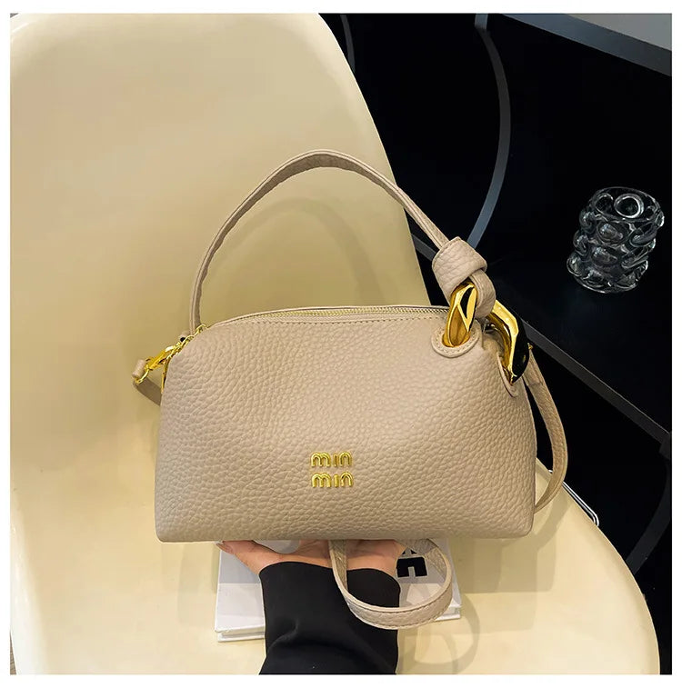 Crossbody bag, hand-held