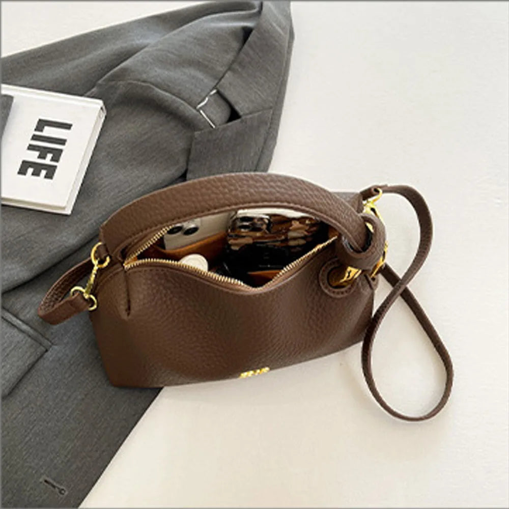 Crossbody bag, hand-held